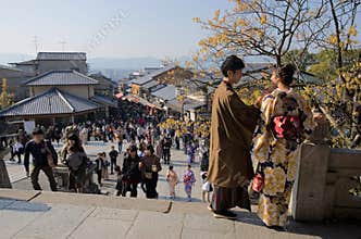 Couple in Kyoto`s crowded center, Japan