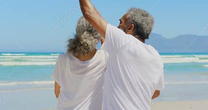 Front view of romantic active senior African American couple dancing together on the beach 4k