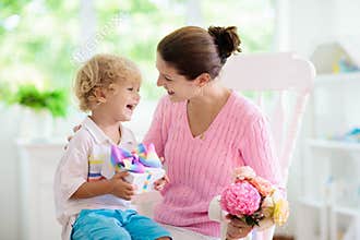 Happy mothers day. Child with present for mom