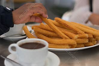 Hot cup of chocolate with artisenal churros