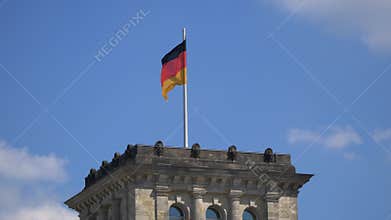 Germany Flag Fluttering Upon The Reichstag Building in Berlin, Germany