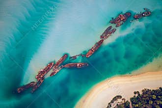 The Tangalooma Wrecks used to be 15 steam driven barges which were deliberately sunk in 1963 along the Moreton Island coastline to