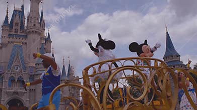 Mickey and Minnie`s Surprise Celebration parade on  cloudy lightblue sky background at Walt Disney World.