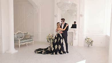 Halloween. Creepy couple with makeup on their face in room with vintage interior