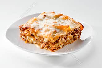 Lasagna piece on white plate close-up