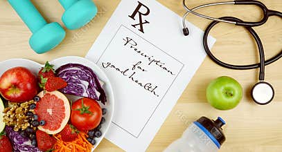 Prescription for good health diet and exercise flat lay overhead.