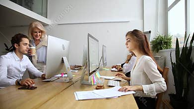 Corporate employees group working on pc computers in office together