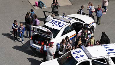 Motion of policeman showing to children how to defense bad guy at police station