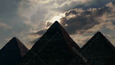 Sun appears over ancient pyramids