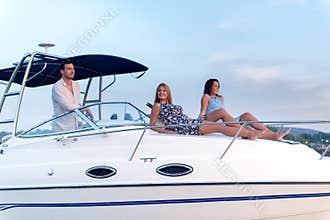 Young people enjoying on a boat