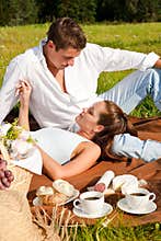 Summer picnic - Happy couple in meadow