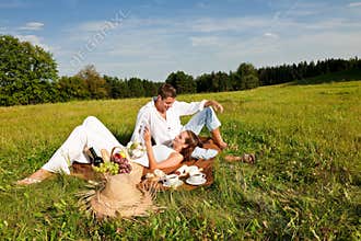 Summer picnic - Young couple relaxing in nature
