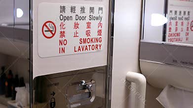 Close up on no smoking sign in airplane lavatory
