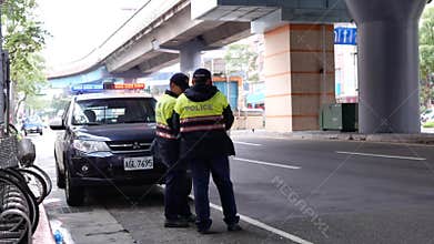 Daytime outdoor shot of red and blue emergency lights of police car
