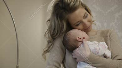 A woman with a baby in her arms