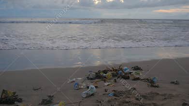 A lot of trash and plastic wastes on ocean beach after the storm. Kuta, Bali, Indonesia.