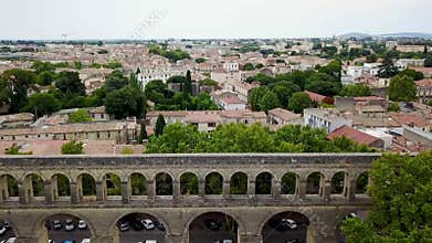 Aerial footage of Saint-Clément historical aqueduct and mediterranean city panorama
