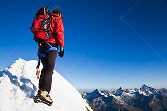 Mountaineer on a snowy ridge