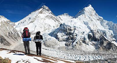 Mount Everest from Pumo Ri base camp with two tourists