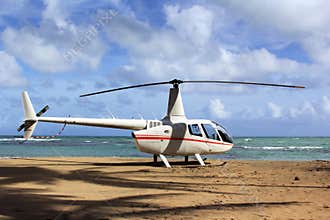Small helicopter for excursions on a deserted beach