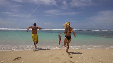 Family with child on the beach.