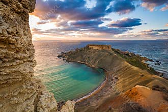 Mgarr, Malta - Panorama of Gnejna bay, the most beautiful beach in Malta at sunset