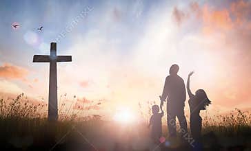 Family Silhouette Worshiping Near Cross At Sunrise Faith And Hope Concept