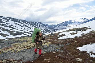 Khibiny, Kola Peninsula, Russia, June, 28, 2017 . Tourist woman going to the Ramzai Ramzai pass in Khibiny mountains