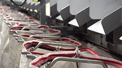 Staff working at the automated parcel sorting system filling bags