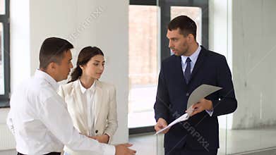 Realtor with folder showing documents to customers