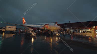 Baggage loading into Czech Airlines plane at night, Sheremetyevo Airport