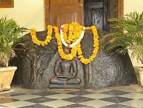 Black stone sculpture of ancient Hindu poet Valmiki