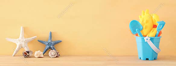 vacation and summer banner with sea life style objects and beach toys for kid.