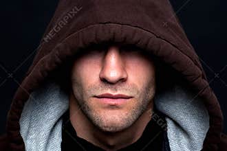 Evil looking hooded man