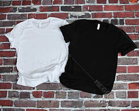 Flat lay mockup of white tshirt and black tshirt on brick background