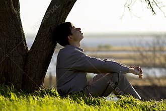 Young man turns to God with hope, the concept of faith and spirituality