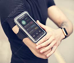 A man wearing a smartphone armband