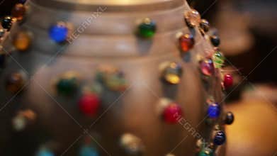 Souvenir with multicolor gems. Stock. Expensive chic souvenir from Asia