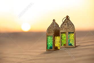 Traditional ornamental arabic candle in desert.