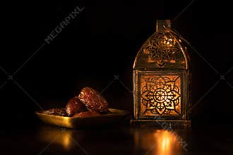 Traditional ornamental arabic candle in dark light.