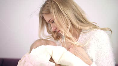Feminine woman enjoy breastfeeding child. Mother breast feeding kid