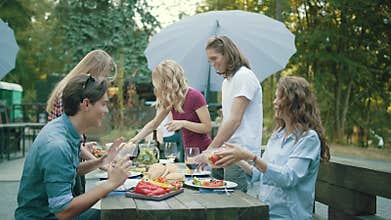 People Eating Healthy Food On Outdoor Party.