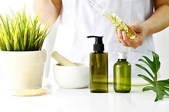 Natural cosmetic or skincare development in laboratory, Organic extract in cosmetic bottle container.
