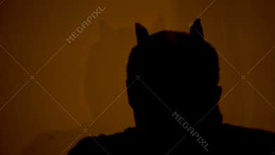 Werewolf zombie shadow on wall, man turning into terrible creature, nightmare