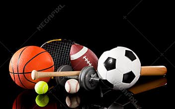 Assorted sports equipment on black