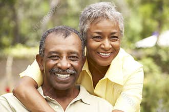 Senior Couple Relaxing In Garden
