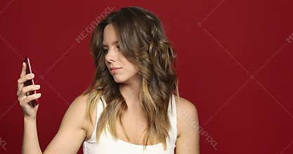 Woman talking on telephone annoyed and impatient