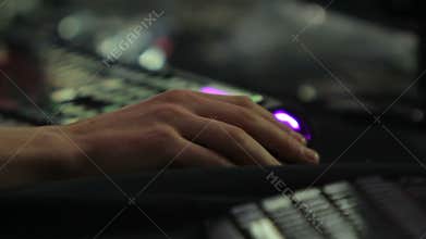 Hand of computer game addict pushing buttons on mouse, eSports competition