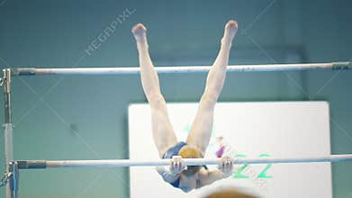 KAZAN, RUSSIA - APRIL 19, 2018: All-Russian gymnastics championship -Female gymnast performing on the bars