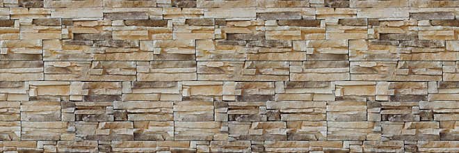 Stone wall brick texture. Seamless pattern. Background of the Sandstone facade.
